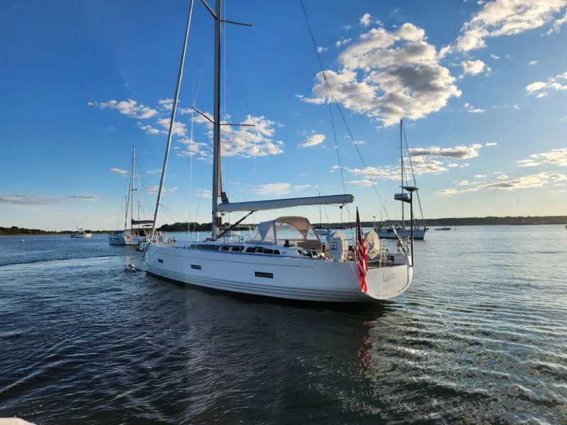 Slide: The Image of 2018 X-Yachts X4.9 sailboat on calm water under a clear blue sky. - 8