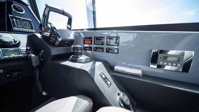 Slide: The Image of Control panel of 2025 Hanover 387 Outboard boat with modern navigation equipment. - 10
