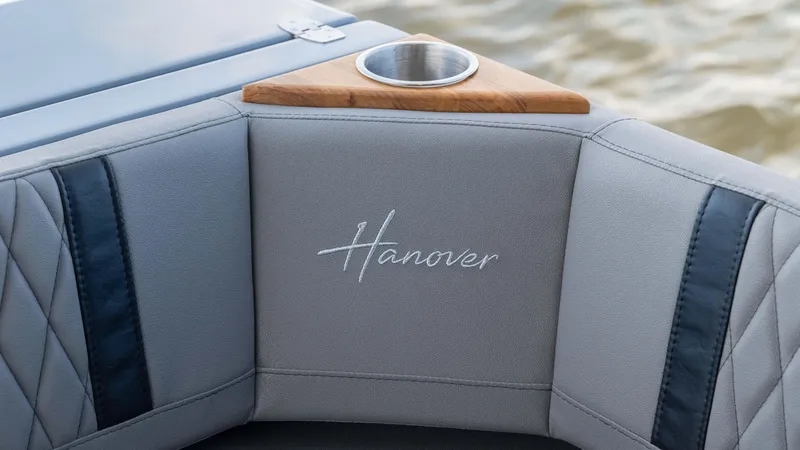 Slide: The Image of 2025 Hanover 387 Outboard boat interior with cup holder and embroidered logo. - 16
