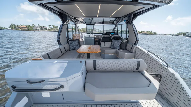 Slide: The Image of Luxurious 2025 Hanover 387 Outboard boat interior with spacious seating and modern design on the water. - 18