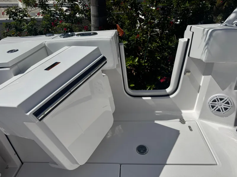 Slide: The Image of 2026 Blackfin 272 DC boat interior with sleek white design and modern features. - 12
