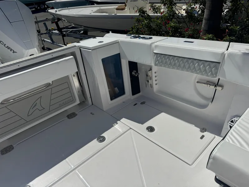 Slide: The Image of 2026 Blackfin 272 DC boat interior with sleek white design and modern features. - 15