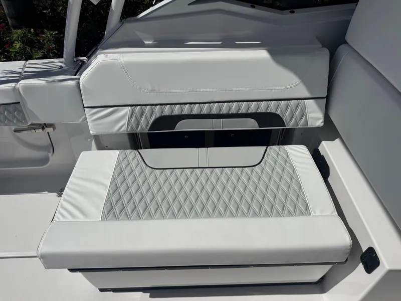 Slide: The Image of 2026 Blackfin 272 DC boat seat with diamond-patterned upholstery. - 16