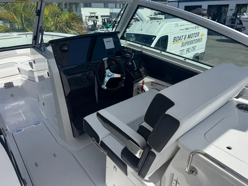 Slide: The Image of 2026 Blackfin 272 DC boat interior with modern helm and seating. - 22