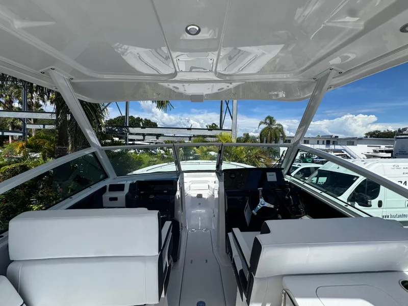Slide: The Image of Interior view of 2026 Blackfin 272 DC boat with modern seating and dashboard. - 24