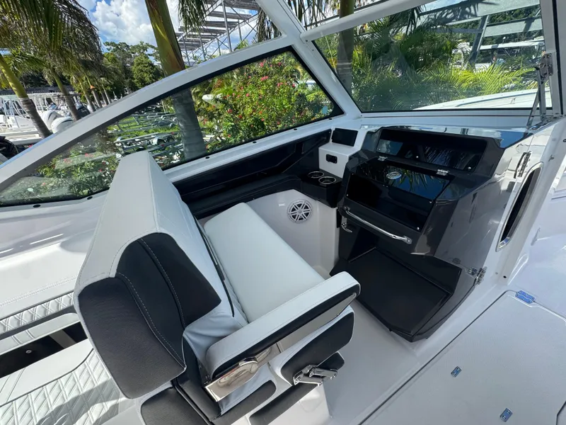 Slide: The Image of 2026 Blackfin 272 DC boat interior with modern helm and seating. - 28