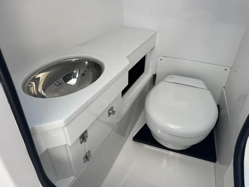 Slide: The Image of 2026 Blackfin 272 DC boat bathroom with modern sink and toilet. - 30