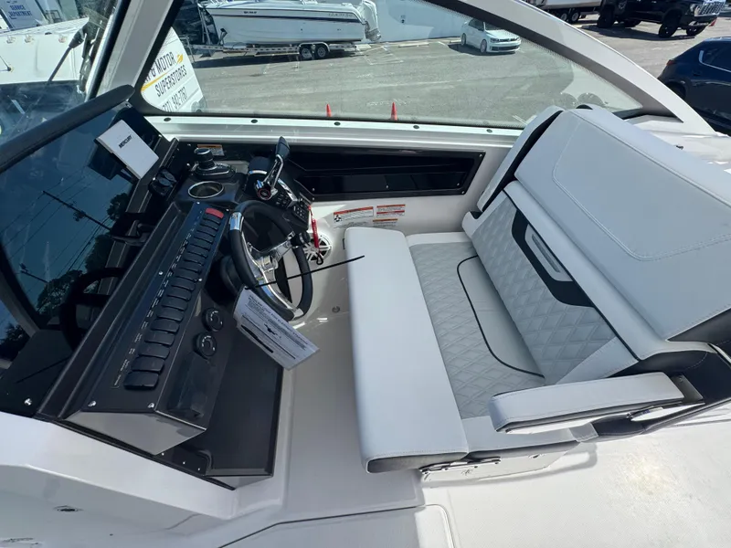 Slide: The Image of 2026 Blackfin 272 DC boat interior with modern dashboard and seating. - 41