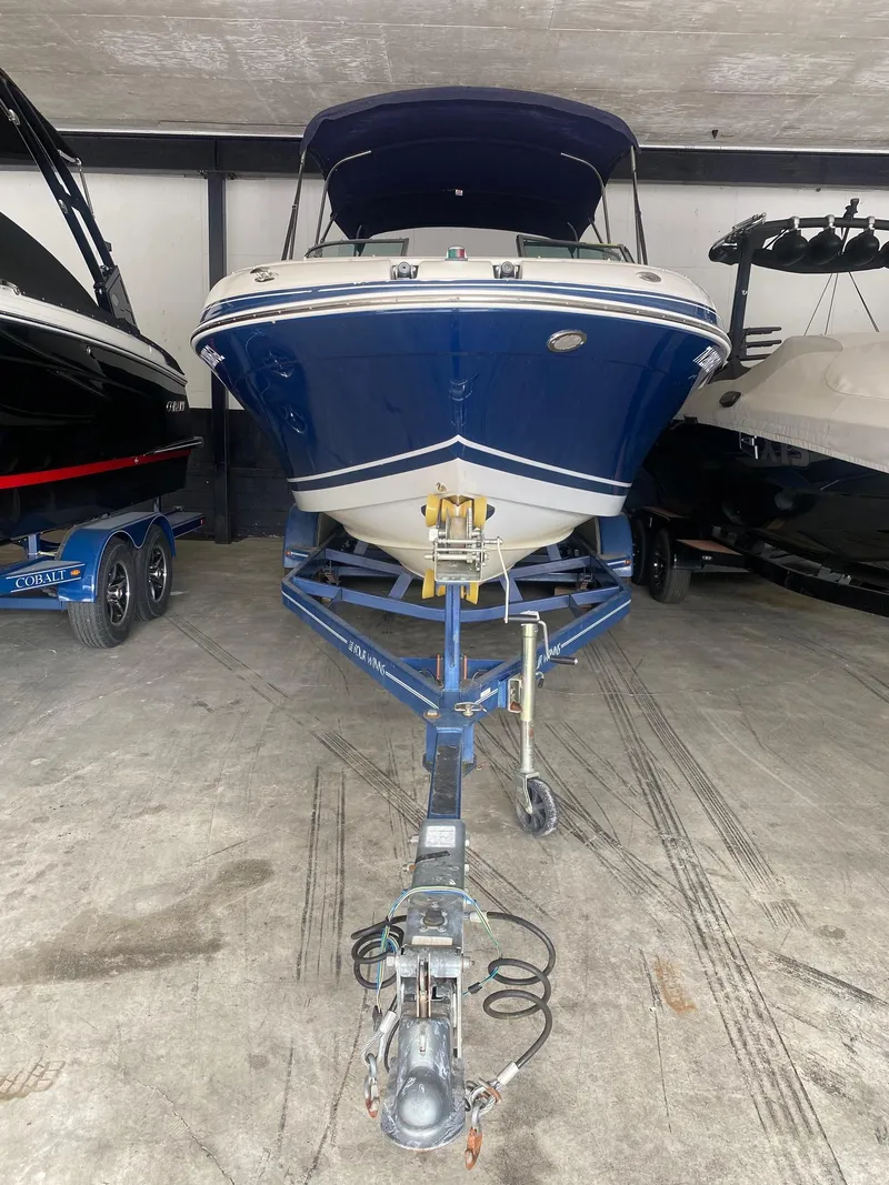 Slide: The Image of 2008 Four Winns H260 boat on trailer in storage facility. - 3