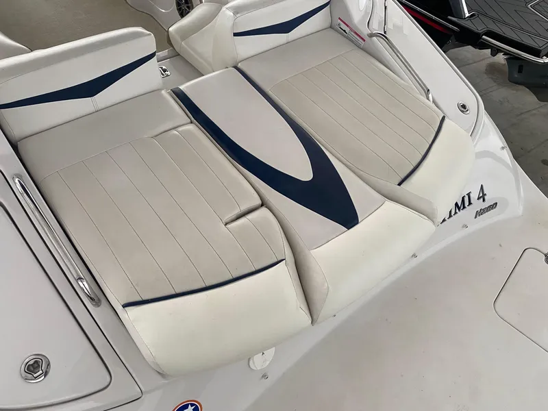 Slide: The Image of 2008 Four Winns H260 boat seating with white and blue upholstery. - 8