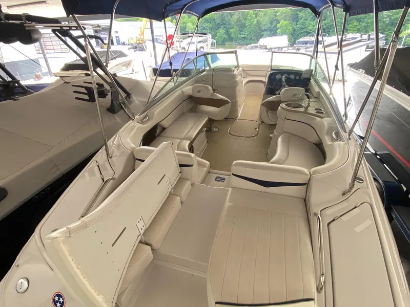 Slide: The Image of 2008 Four Winns H260 boat interior with spacious seating and canopy. - 9