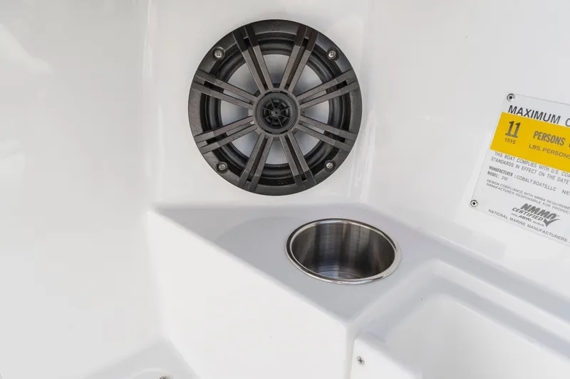 Slide: The Image of Speaker and cup holder on 2016 Cobalt 200 boat interior. - 10