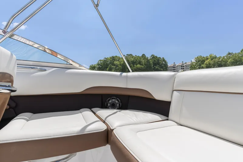 Slide: The Image of Interior of a 2016 Cobalt 200 boat with white and brown seating. - 12