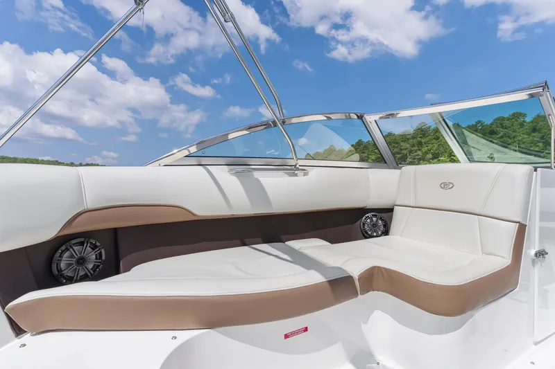 Slide: The Image of Luxurious interior of 2016 Cobalt 200 boat with white seating and blue sky background. - 13