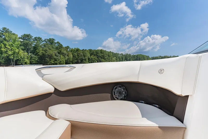 Slide: The Image of Luxurious interior of a 2016 Cobalt 200 boat with white seating and scenic background. - 15