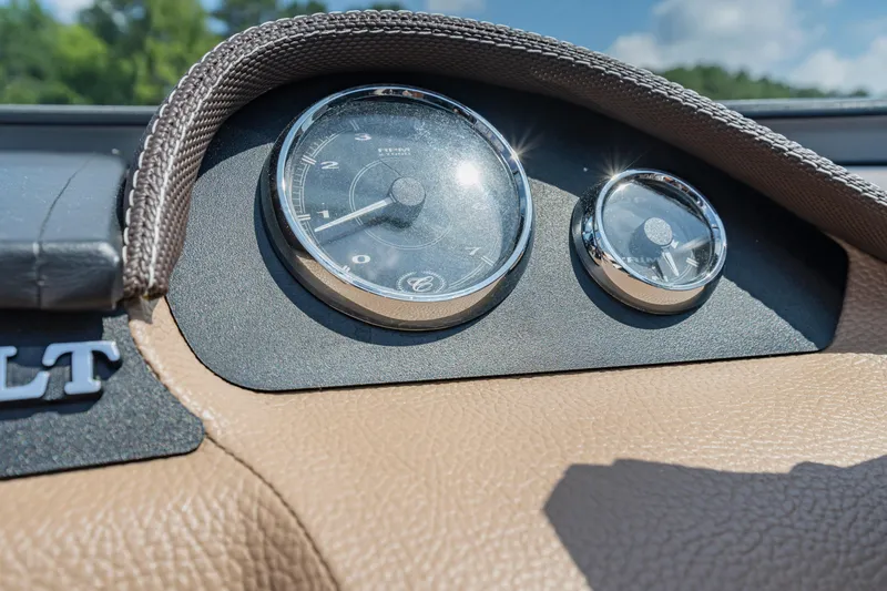Slide: The Image of Dashboard of a 2016 Cobalt 200 with analog gauges and brown trim. - 21