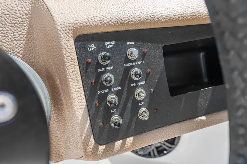 Slide: The Image of Control panel of a 2016 Cobalt 200 boat with various switches. - 7