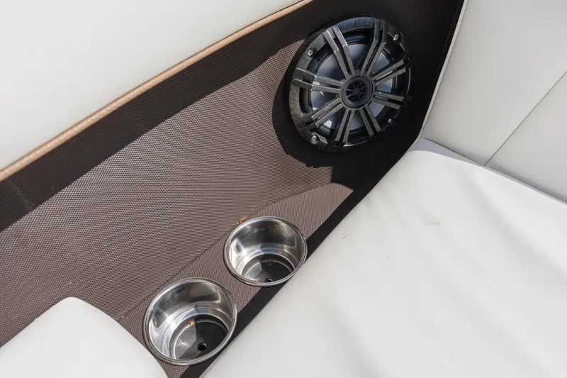 Slide: The Image of Speaker and cup holders in 2016 Cobalt 200 boat interior. - 9
