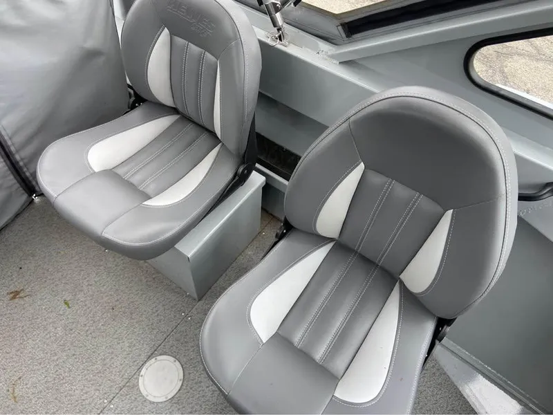 Slide: The Image of 2018 Hewescraft 160 Sportsman boat interior with two gray and white seats. - 5