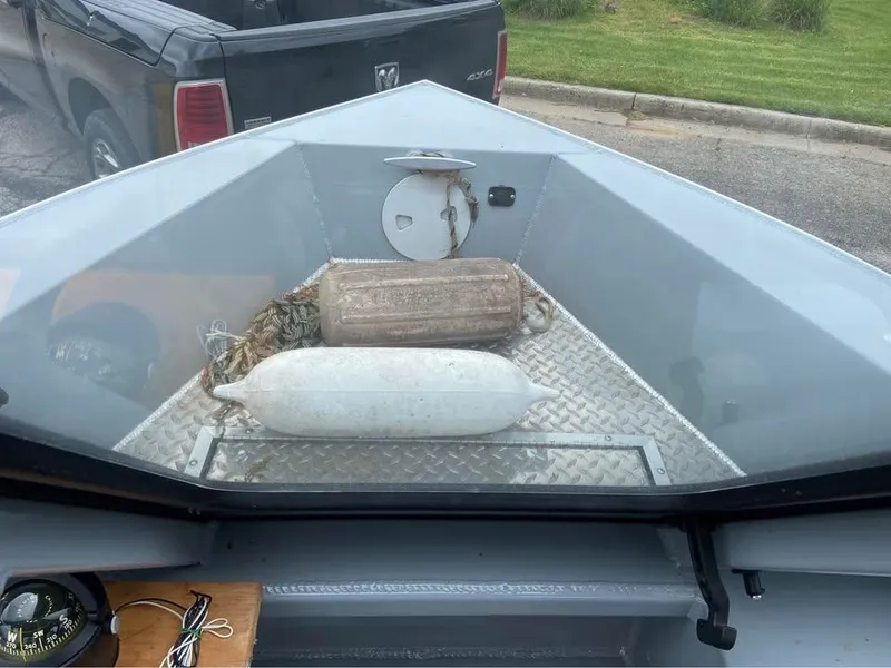 Slide: The Image of 2018 Hewescraft 160 Sportsman boat with fenders and rope on deck. - 7