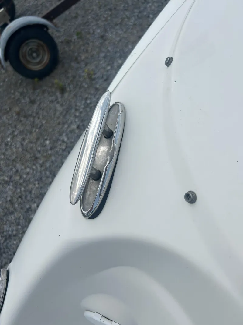 Slide: The Image of Close-up of a 2005 Stingray 250 LR boat cleat on a white surface. - 26