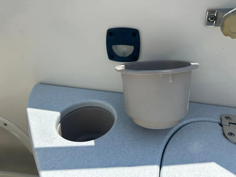 Slide: The Image of Cup holder and compartment on a 2005 Stingray 250 LR boat. - 32