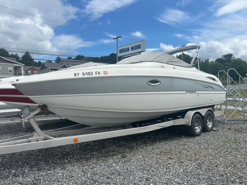 Slide: The Image of 2005 Stingray 250 LR boat on trailer at Morgan Marine dealership. - 6