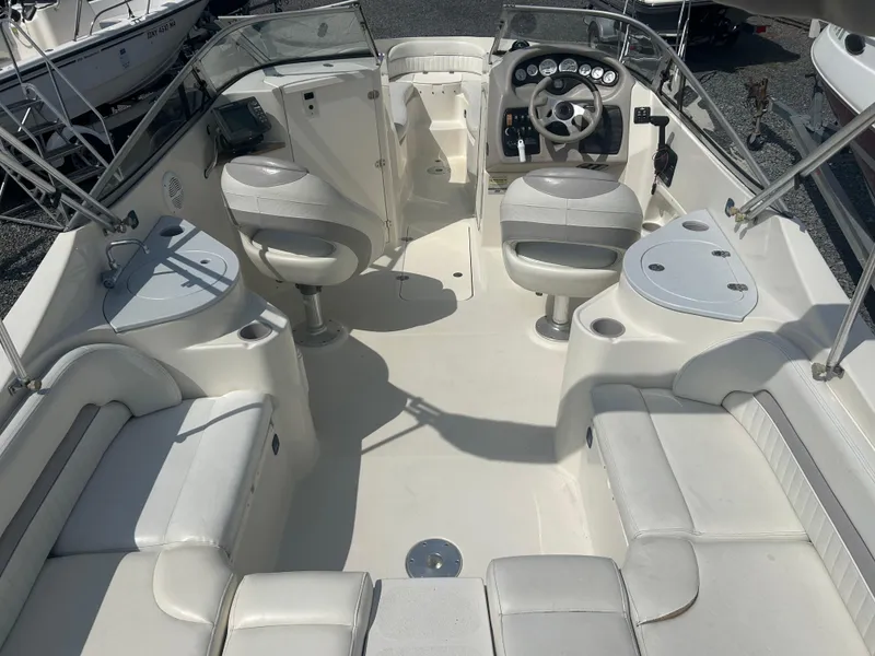 Slide: The Image of 2005 Stingray 250 LR boat interior with seating, steering wheel, and control panel. - 7