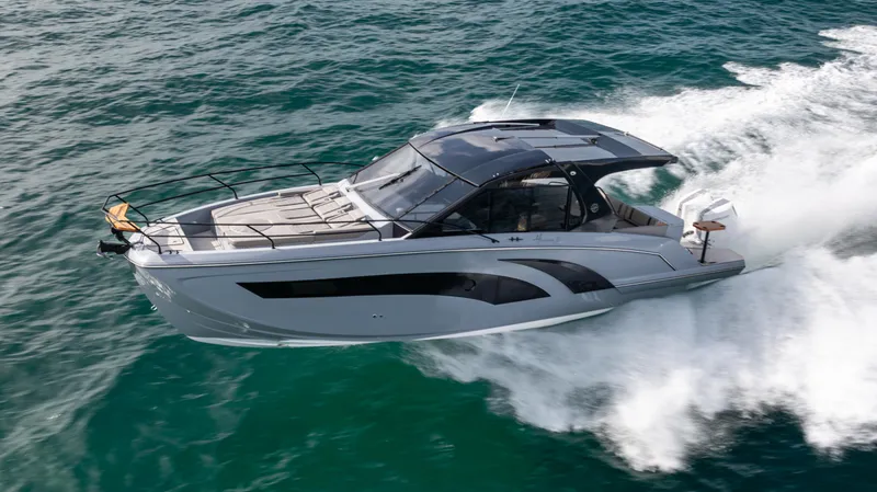 The Image of 2025 Hanover 387 Outboard cruising on open water, showcasing sleek design and performance. - 0