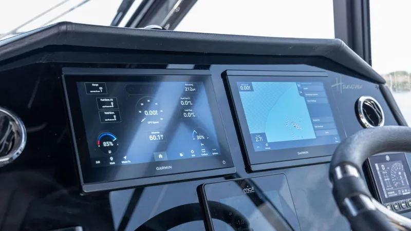 Slide: The Image of Dashboard of 2025 Hanover 387 Outboard with dual Garmin displays. - 13