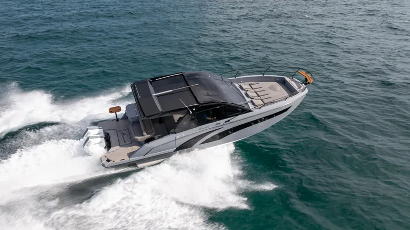 Slide: The Image of 2025 Hanover 387 Outboard boat cruising on open water. - 5
