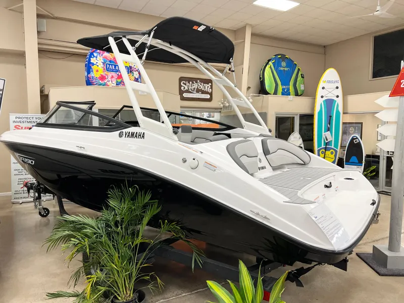Slide: The Image of 2025 Yamaha Boats AR190 on display in showroom, rear view. - 2
