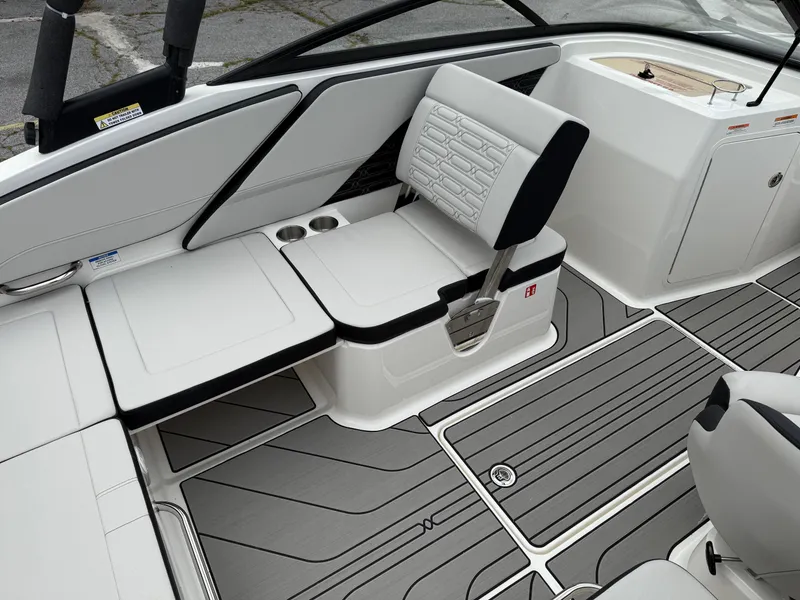 Slide: The Image of 2025 Sea Ray SPX 210 boat interior with sleek seating and modern design. - 10