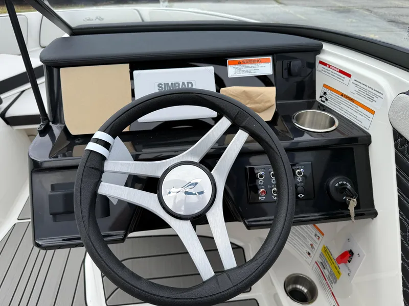 Slide: The Image of Steering wheel and dashboard of 2025 Sea Ray SPX 210 boat. - 12