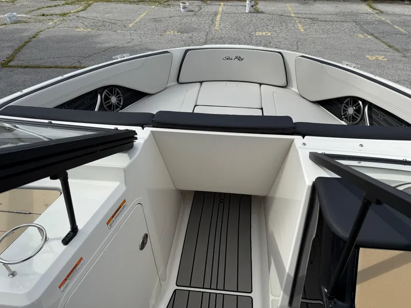 Slide: The Image of 2025 Sea Ray SPX 210 boat interior with sleek seating and modern design. - 13