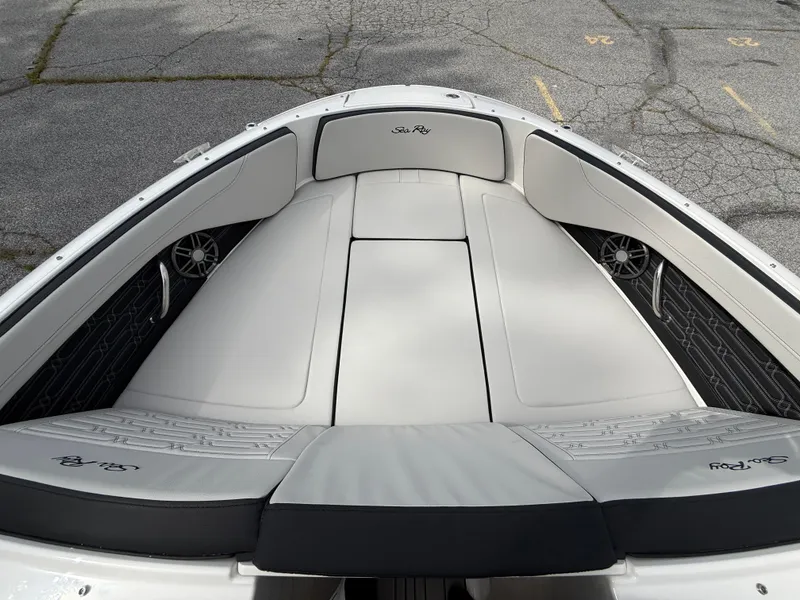 Slide: The Image of 2025 Sea Ray SPX 210 boat interior with cushioned seating and speakers. - 14