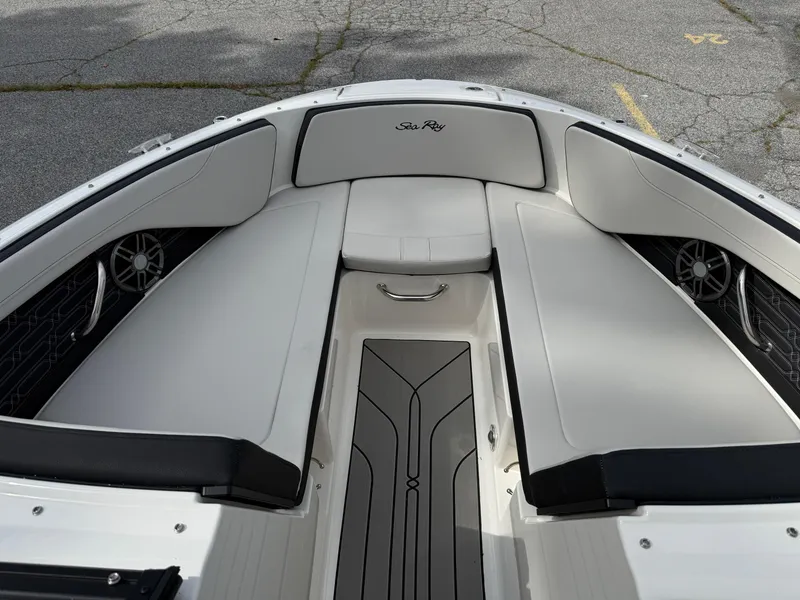 Slide: The Image of 2025 Sea Ray SPX 210 boat interior with sleek seating and modern design. - 15