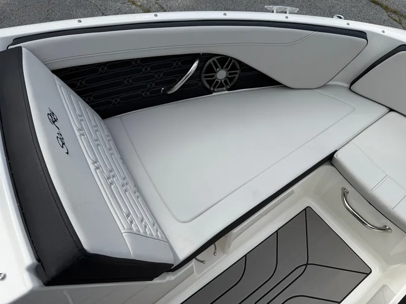 Slide: The Image of 2025 Sea Ray SPX 210 boat interior with sleek white seating and modern design. - 16