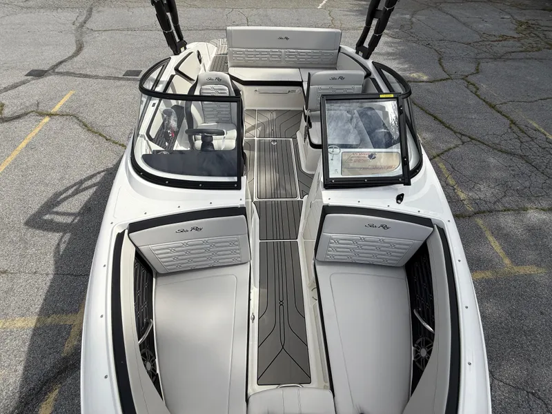 Slide: The Image of 2025 Sea Ray SPX 210 boat interior with sleek seating and modern design. - 18