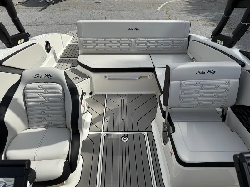 Slide: The Image of 2025 Sea Ray SPX 210 boat interior with sleek seating and modern design. - 19