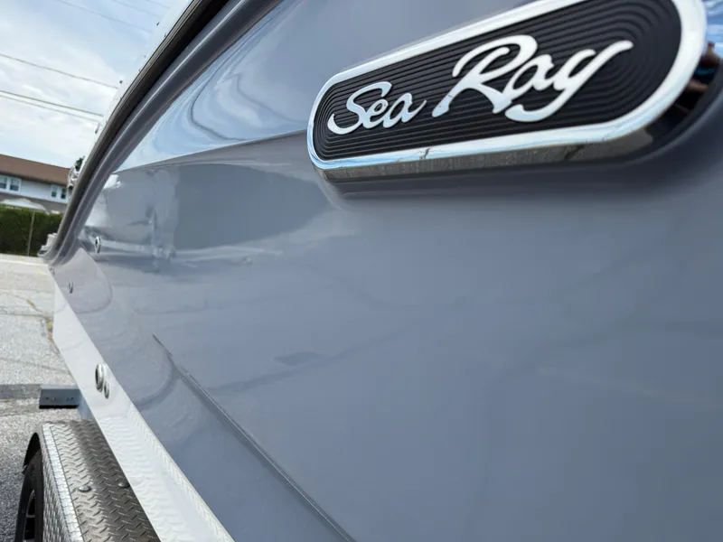 Slide: The Image of 2025 Sea Ray SPX 210 boat side view with logo detail. - 3