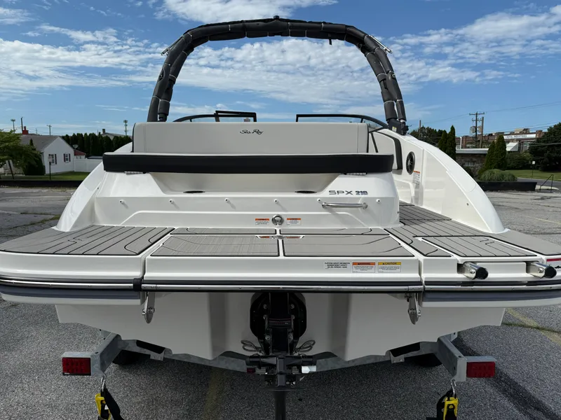 Slide: The Image of 2025 Sea Ray SPX 210 boat rear view with swim platform and wakeboard tower. - 4