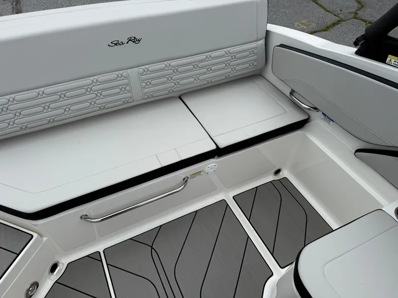 Slide: The Image of 2025 Sea Ray SPX 210 boat interior with sleek seating and modern design. - 9