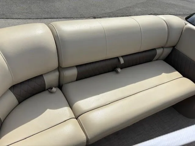 Slide: The Image of 2023 Sun Tracker SportFish 20 DLX boat seating, beige upholstery, outdoor setting. - 5