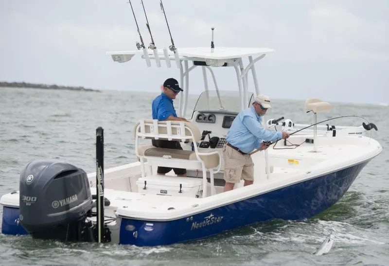 Slide: The Image of Manufacturer Provided Image: 2014 NauticStar 244 XTS boat with Yamaha engine, two men fishing. - 6