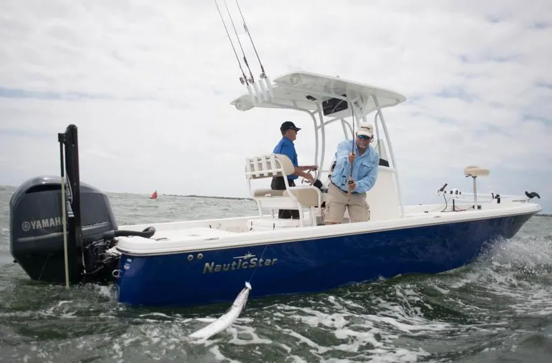 Slide: The Image of Manufacturer Provided Image: 2014 NauticStar 244 XTS boat on water with two people fishing. - 7