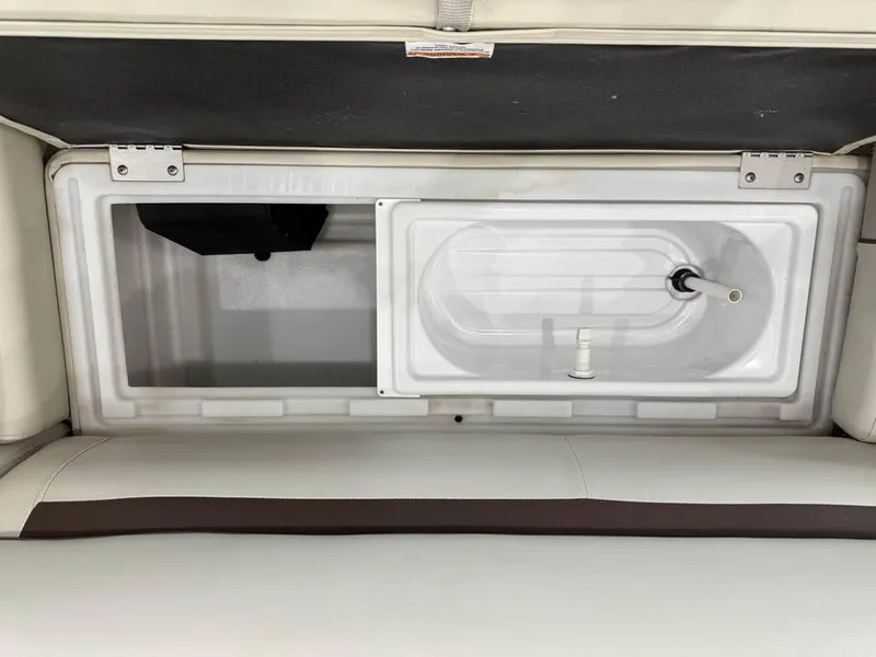 Slide: The Image of Open storage compartment in a 2020 Godfrey SR 226 BF boat. - 15