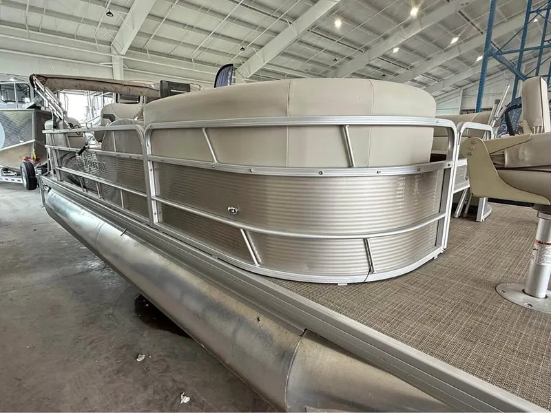 Slide: The Image of 2020 Godfrey SR 226 BF pontoon boat in a showroom, showcasing seating and railing. - 3