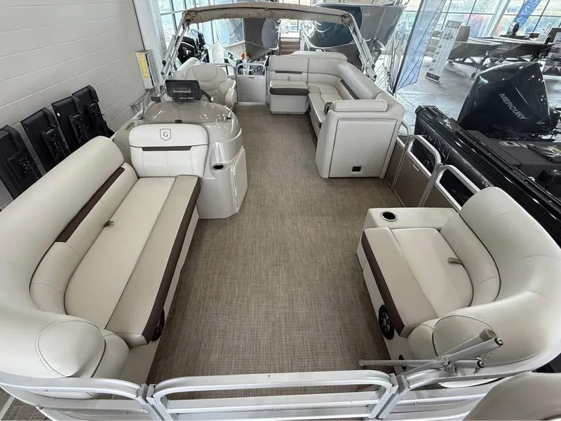 Slide: The Image of 2020 Godfrey SR 226 BF pontoon boat interior with beige seating and spacious layout. - 6