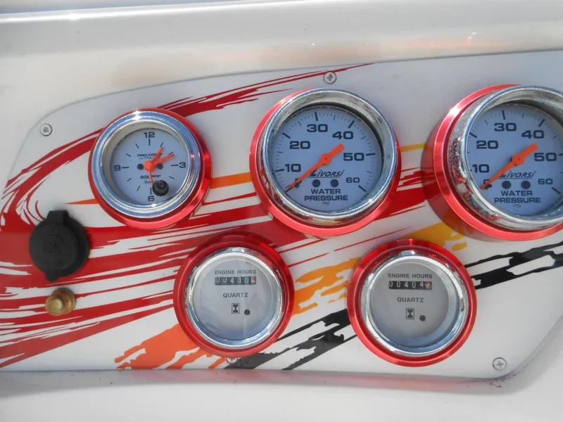 Slide: The Image of Dashboard of 2007 Sunsation 32 SS boat with gauges and colorful design. - 12
